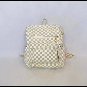 White and grey checkered backpack